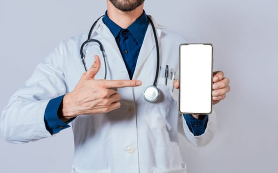 Doctor showing and pointing to blank cell phone screen. Doctor recommending on cell phone screen isolated