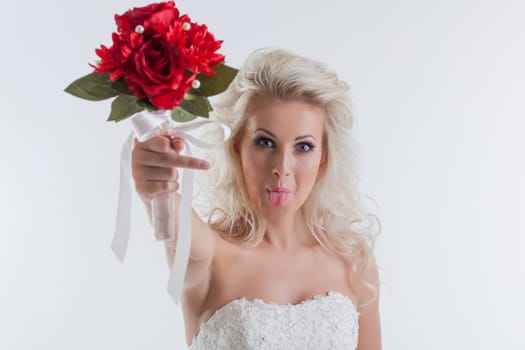 Portrait of funny young bride posing in studio, close-up