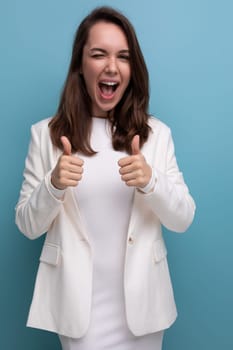 smiling young brunette with long hair lady in white dress has a cool idea and wants to tell about it.