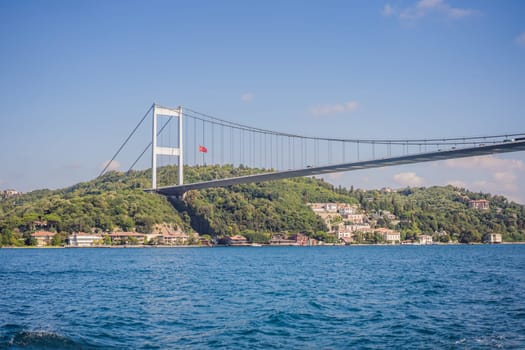 Turkey, Istanbul, houses below Fatih Sultan Mehmet Bridge on Bosphorus Strait.