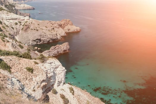 Aerial panoramic view of beautiful sunset above sea. Beautiful seascape. Sun glare, small waves on the water surface. Evening. Horizon. Nobody. No people. Copy space. Never-ending beauty of nature