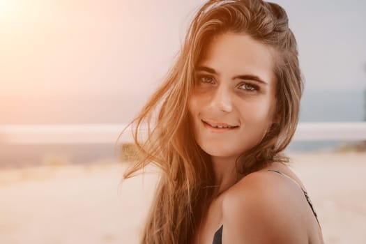 Happy woman portrait in cafe. Boho chic fashion style. Outdoor photo of young happy woman with long hair, sunny weather outdoors sitting in modern cafe