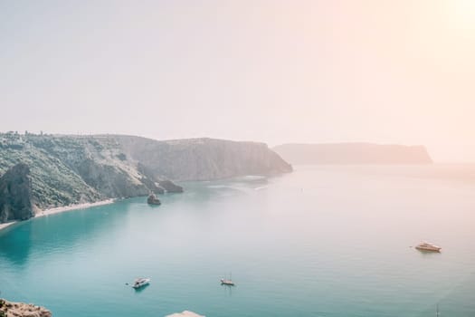 Aerial panoramic view of beautiful sunset above sea. Beautiful seascape. Sun glare, small waves on the water surface. Evening. Horizon. Nobody. No people. Copy space. Never-ending beauty of nature