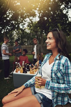This is the life. a young woman enjoying a party with friends outdoors
