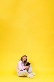 Funny little blonde kid girl 12-13 years old studio portrait. Childhood lifestyle conception