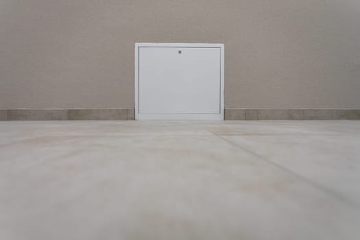 Right at the floor itself are installed white inspection doors for heating or water installation. View at the very floor.