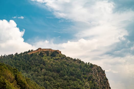 View of Alanya castle from Cleopatra beach on a sunny day