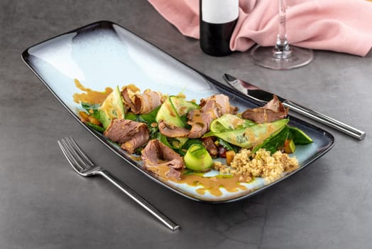 Pastrami salad on stone table in fine dining restaurant