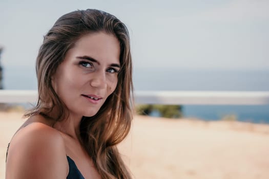 Happy woman portrait in cafe. Boho chic fashion style. Outdoor photo of young happy woman with long hair, sunny weather outdoors sitting in modern cafe