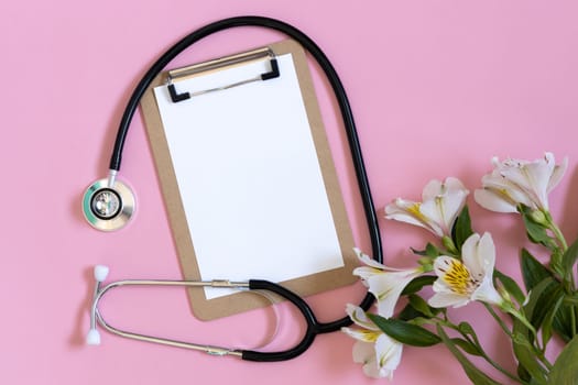 International nurses week. Congratulation for doctors day, space for text. stethoscope on pink background