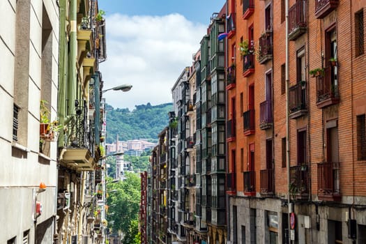 Bilbao, Basque Country, Spain - 11 06 2022: narrow streets with colorful balconies, Bilbao, Spain.