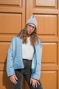 Portrait of a stylish woman in blue jacket. Spring outdoor portrait.