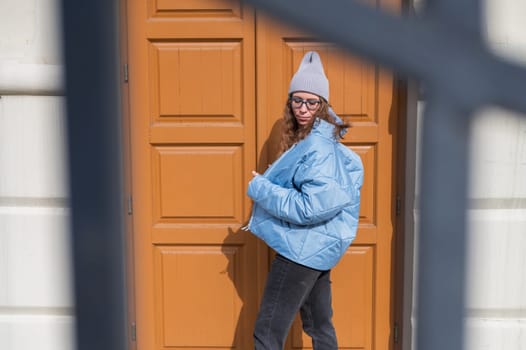 Portrait of a stylish woman in blue jacket. Spring outdoor portrait.