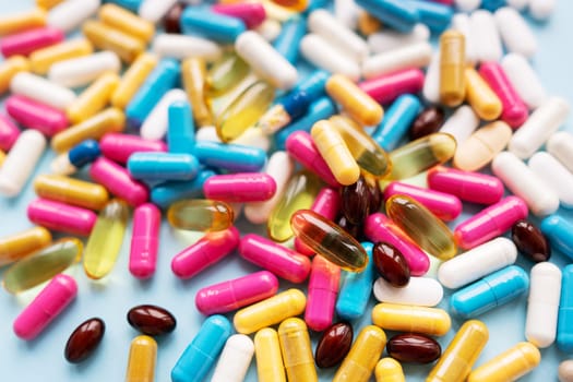 Lots of colorful pills and capsules for different symptoms. Concept of health and medicine