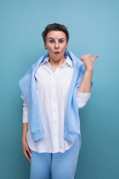 frustrated young woman with short haircut in white casual shirt.