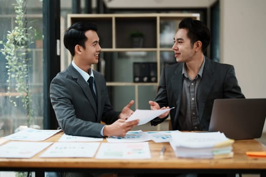 startup Asian business advisor meeting to analyze and discuss the situation on the financial report in the meeting room.Investment Consultant, Financial , teamwork ,brainstorming and accounting