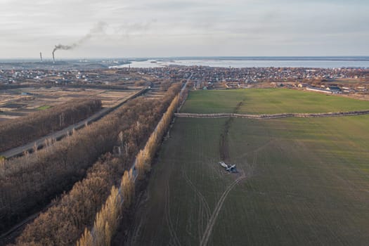 In this picture, an AN-26 aircraft can be seen lying on a field in Ukraine after an accident. The aircraft appears to have suffered significant damage, with parts scattered around the wreckage. The image conveys the severity of the accident and the potential dangers of aviation during the war