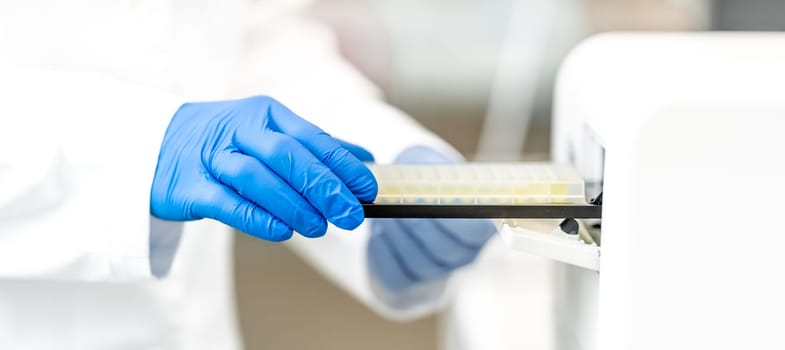 examination of a chemical sample using modern devices in the biochemical laboratory of the research institute. High quality photo