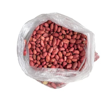 raw peanuts in a cellophane bag on a white background.