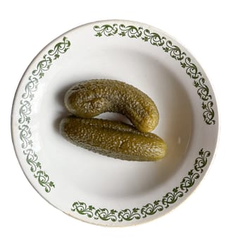 pickles in a plate on a white background.