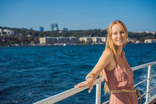 Happy woman enjoying the sea from ferry boat crossing Bosphorus in Istanbul. Summer trip to Istanbul.