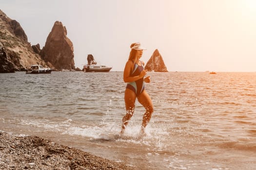 Fitness woman sea. Outdoor workout on yoga mat in park near to ocean beach. Female fitness pilates yoga routine concept. Healthy lifestyle. Happy fit woman exercising with rubber band in park.