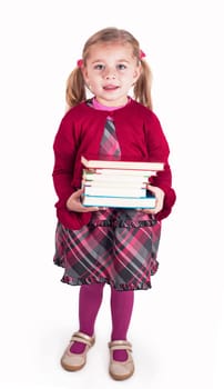 Little girl holding books preparing to go back to school - isolated