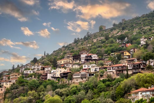 View of the old city of Alanya and the castle walls at sunset