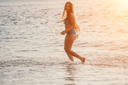 Running woman. Female runner jogging during the sunrise on beach. Woman Runner feet running on the beach at sunrise. woman fitness sunrise jog workout wellness concept.