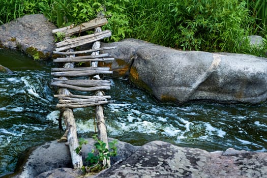 a structure carrying a road, path, railroad, or canal across a river, ravine, road, railroad, or other obstacle