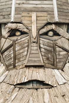 The big face of the wooden sculpture of the hero.