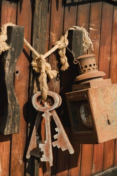 A bunch of old wooden keys hanging on a rope, close-up.