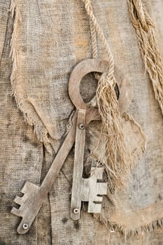 A bunch of old wooden keys hanging on a rope, close-up.