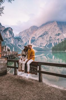 couple on vacation in the Italian Dolomites, Beautiful lake in the Italian Alps, Lago di Braies. 