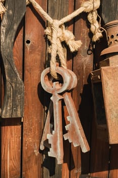 A bunch of old wooden keys hanging on a rope, close-up.