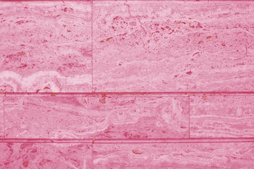 Background of ceramic tiles in new trendy color of 2023 Viva Magenta. Monochrome. Abstract.