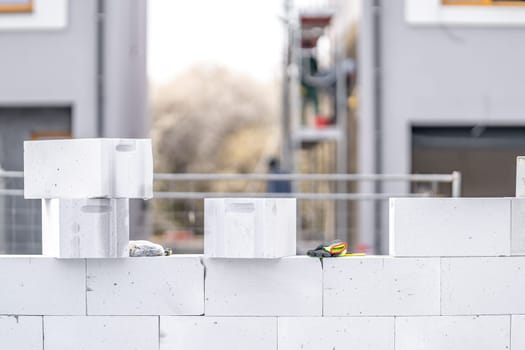 construction of a wall of a house made of concrete bricks.