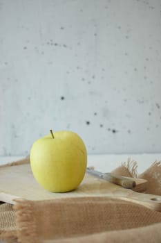 Ripe yellow apple is fresh in the kitchen.