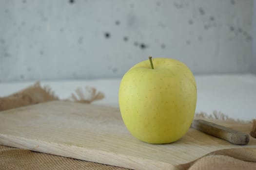 Ripe yellow apple is fresh in the kitchen.