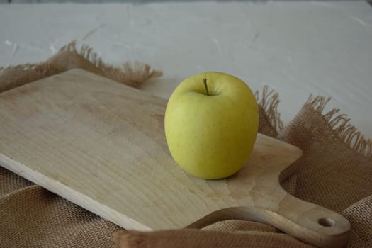 Ripe yellow apple is fresh in the kitchen.