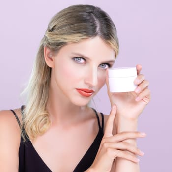 Alluring beautiful perfect cosmetic skin woman portrait hold mockup jar cream or moisturizer for skincare treatment, anti-aging product in pink isolated background. Natural healthy skin model concept.