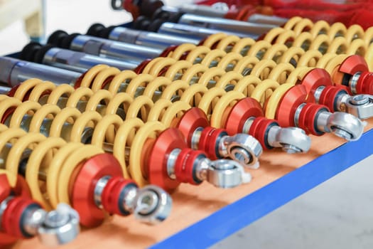 A row of red shock absorbers for car