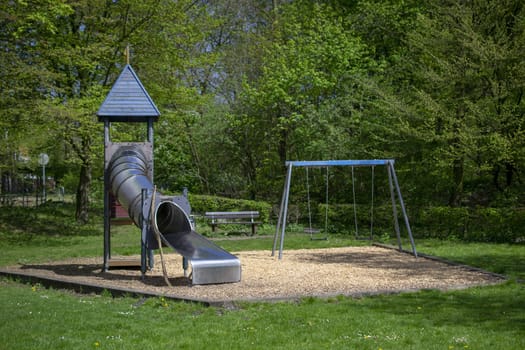 children's playground with slide at a park . High quality photo