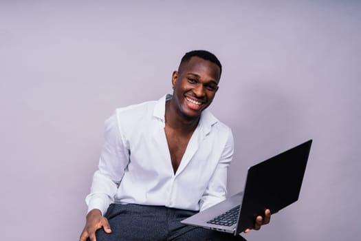 African American millennial businessman isolated on a studio background, successful male formal suit