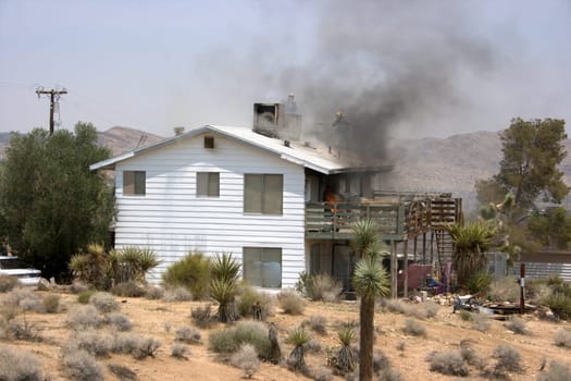 View of House fire, Fire Department trying to put it out.