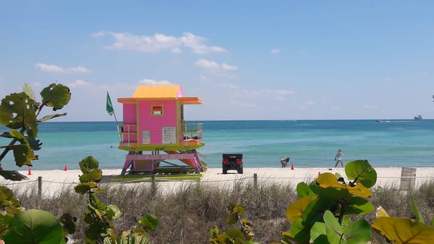 Art deco pink lifeguard tower on the beach in South Beach, Miami, Florida.