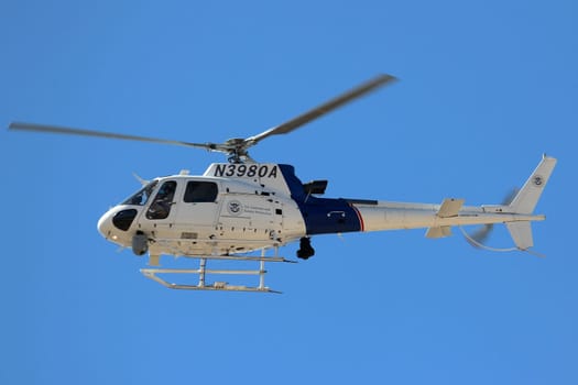 CBP Helicopter. Border Patrol Helicopter flies in the air patrolling the US Border with Mexico. El Paso, Texas, October 21, 2019.