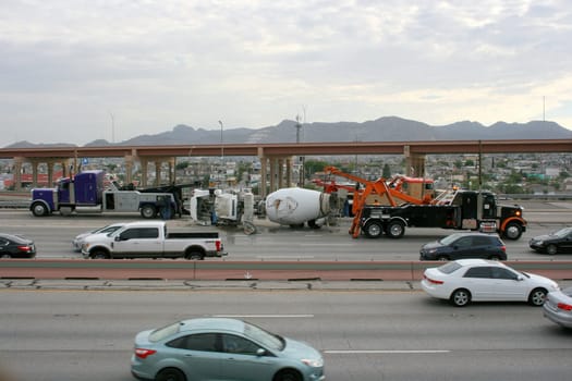A crashed cement truck is lifted from the high way. El Paso, TX. Tuesday, October 22, 2019