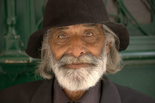 Lissabon, Portugal, July 7, 2002. Old homeless South European Man, with black hat and beard.