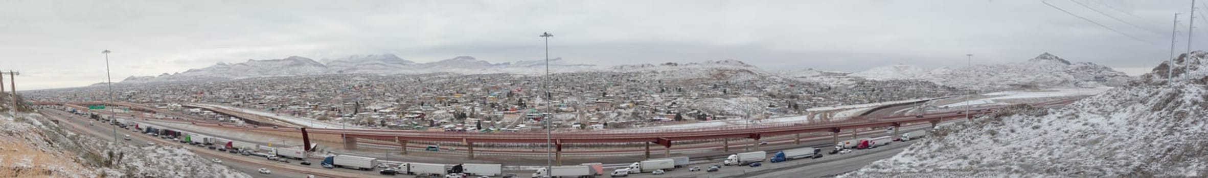 Ciudad Juarez, Chihuahua / Mexico - February 2022 - snow mountain and highway panorama